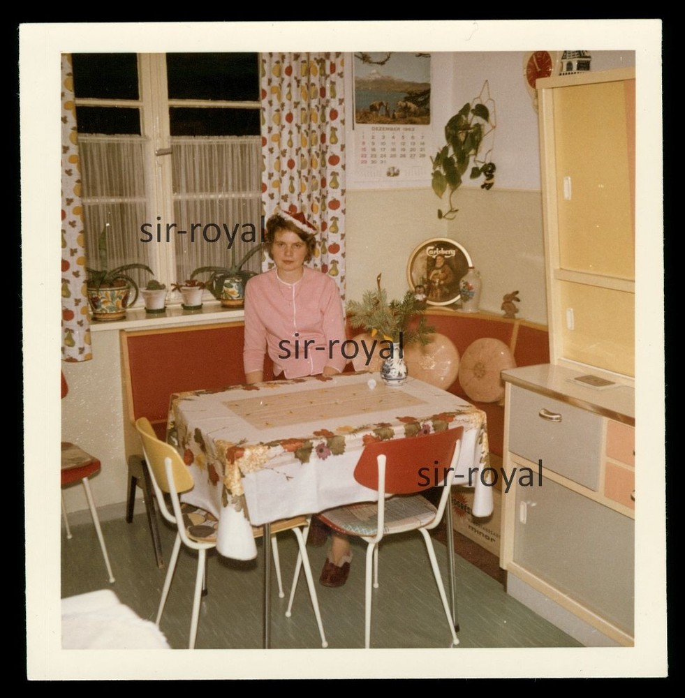 Woman Sitting in 1960s Kitchen – Furnishing Interior Style – Photo 9x9cm