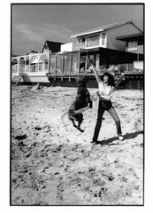 Press Photo. ALE10739. Approximately 23×18 Cm. Beach. Dog. Woman To Identify