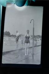 Great old negative woman in cold shower in outdoor pool – 1920s-30s?