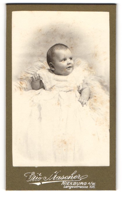 Photograph Otto Mascher, Nienburg a. W., Langestrasse 105, infant in baptismal gown