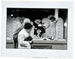 Old Couple Passing Store Window with Dolls-Paris-Photograph-1979-Mark Bugzester