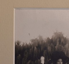 Vintage Photograph of a Woman Wearing a White Dress and a Black Hat