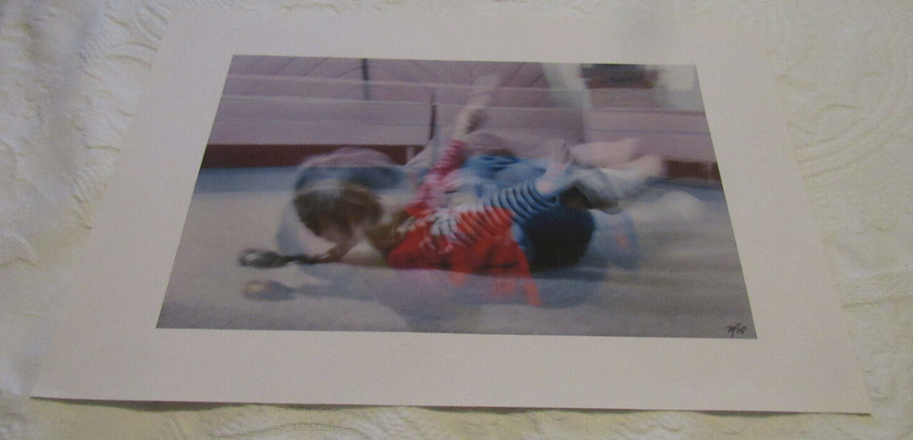 2008 Mark Panza Photo, «child tumbling on floor»; 13″ X 19″, over-exposed