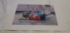 2008 Mark Panza Photo, «child tumbling on floor»; 13″ X 19″, over-exposed