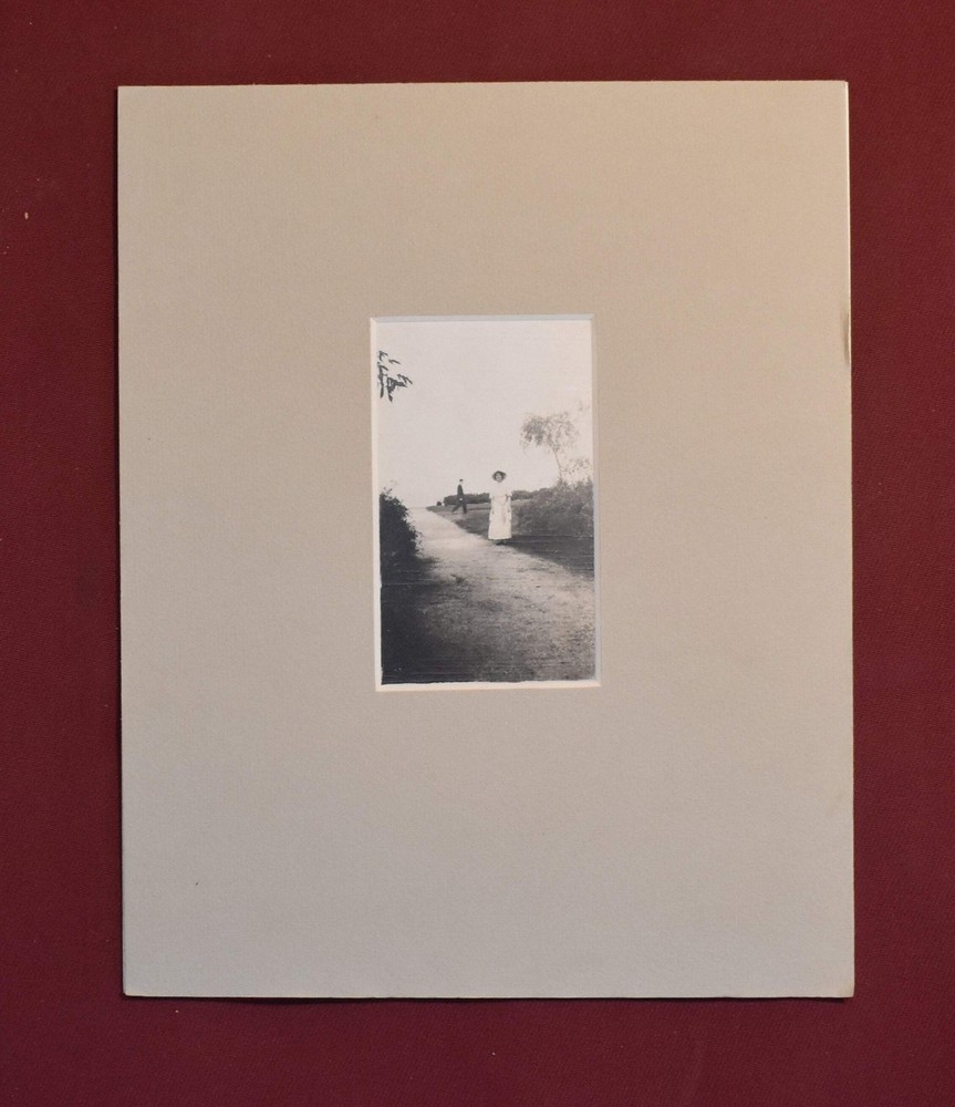 Vintage Photograph of a Woman Standing on a Road, in a Grey Matte Frame