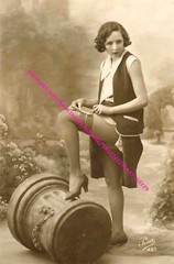 1920s PRETTY GIRL IN SILK STOCKINGS TYING A BOW ON HER THIGH LEGGY PHOTO C-1006