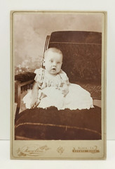 Antique Cabinet Card Baby In A Chair Holding A Bell Knowlton Studio Albia Iowa