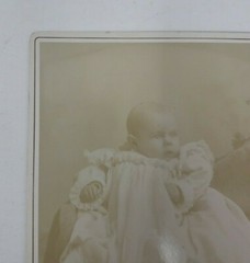 Antique Cabinet Card Photograph- Baby in a white dress sitting for a photograph
