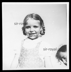Blonde Girl with Pigtails Laughing at Camera – Photo 9x9cm