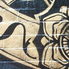 Street Art Gold on Black Brick NYC, Litho Print on Board, Photograph 18″ x 24″