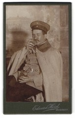 Photograph Eduard Heid, Rastatt, soldier in uniform gets drunk in studio, Sc