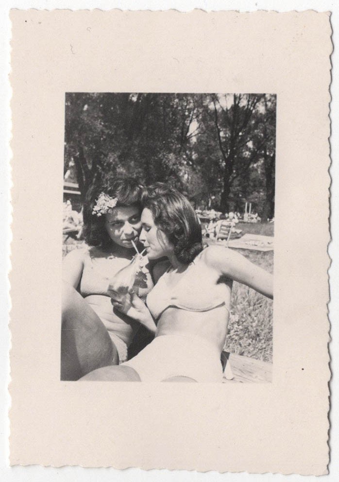 Original 1950s two affectionate pretty ladies in bikinis