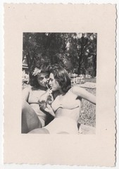Original 1950s two affectionate pretty ladies in bikinis