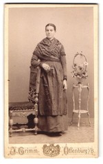 Photograph J. Grimm, Offenburg, woman with scarf next to chair and flower stand