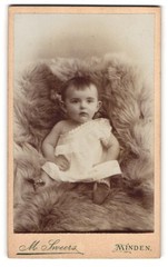Photograph M. Sweers, Minden, Bäckerstr. 25, cute baby in white dress on fur