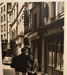 J.W. Howlett Black + White Photograph Focusing on a Man + Woman in an Urban Area