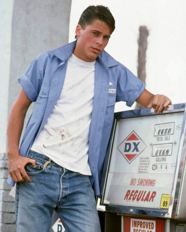 Robe Lowe posing in overalls at gas station for The Outsiders 16×20 Poster