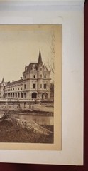 Vintage Black and White Photograph of a Large Building with a Courtyard