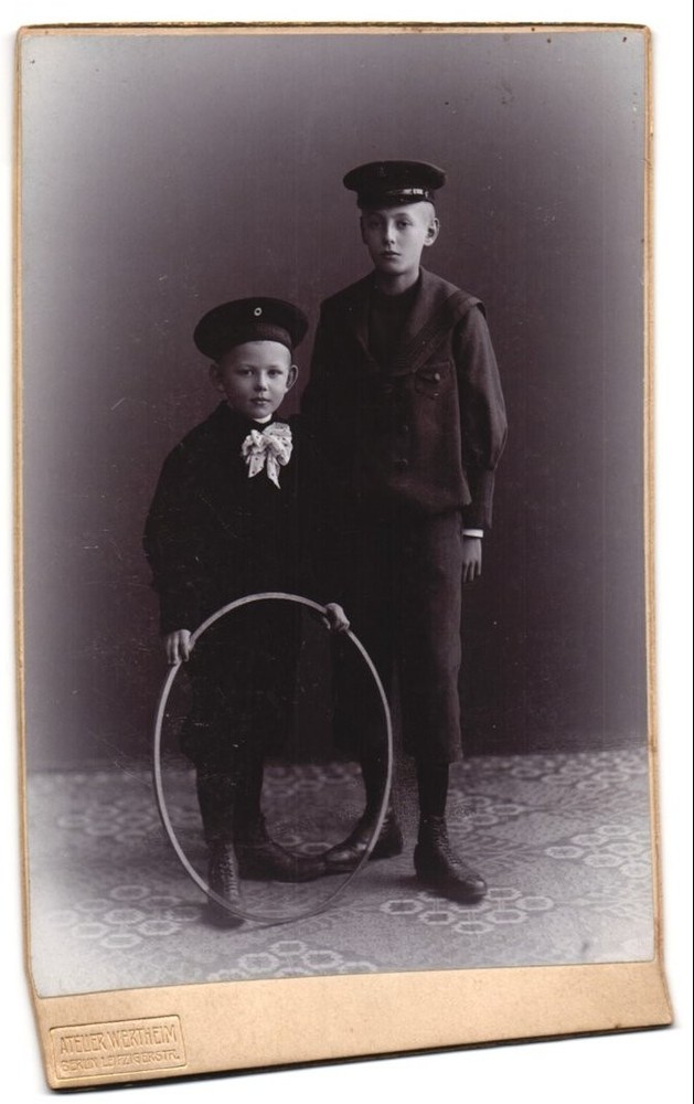 Photograph Wertheim, Berlin, Leipzigerstraße, 2 boys in uniform with tires