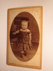 Small child standing next to a chair/CDV Detlef Mehlert Meldorf and Marne