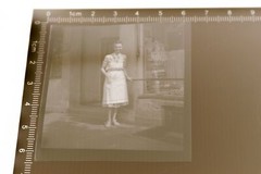 old negative – woman standing in front of shop food – civil advertising