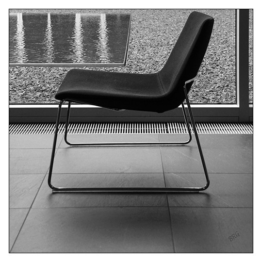Window View With An Empty Chair – Black And White 12″x12″ Art Print