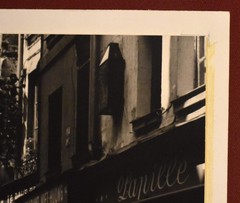 J.W. Howlett Black + White Photograph Focusing on a Man + Woman in an Urban Area