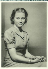 Half portrait sitting half right. Photograph (probably a gelatin silver print