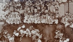 Antique Photograph Depicting a Woman’s Memorial with a Floral Arrangement