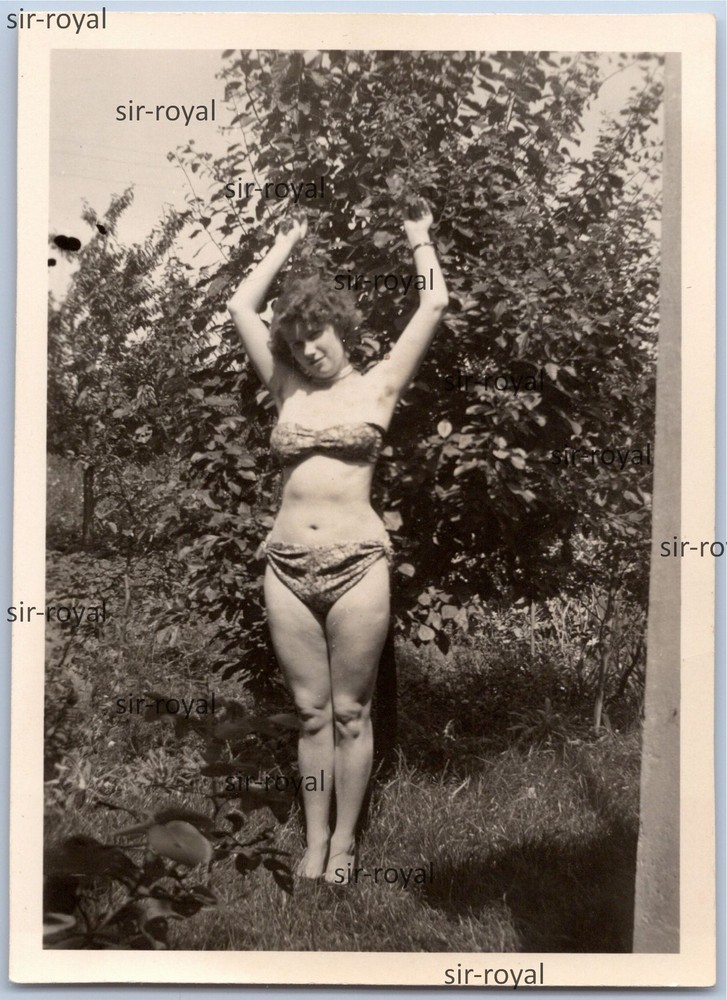 Pretty woman lasciviously lolls in bikini and shows underarm hair – photo 6x9cm