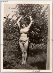 Pretty woman lasciviously lolls in bikini and shows underarm hair – photo 6x9cm