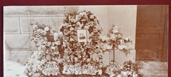 Antique Photograph Depicting a Woman’s Memorial with a Floral Arrangement