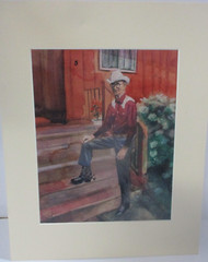 Matted Photograph of a Painting of a Cowboy