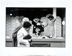 Old Couple Passing Store Window with Dolls-Paris-Photograph-1979-Mark Bugzester