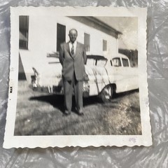 Vintage Black and White Photograph Man in Suit by Classic Car March 1959