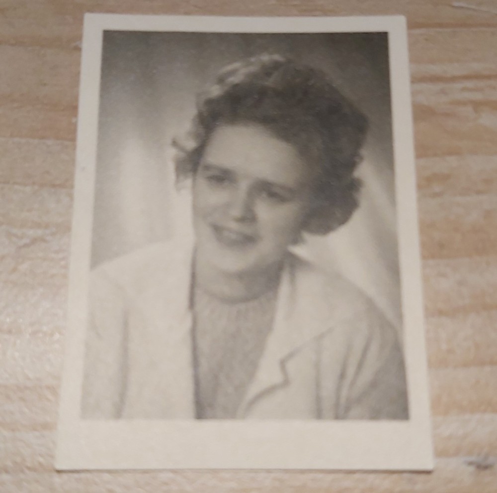 small old b/w photo passport photo young woman