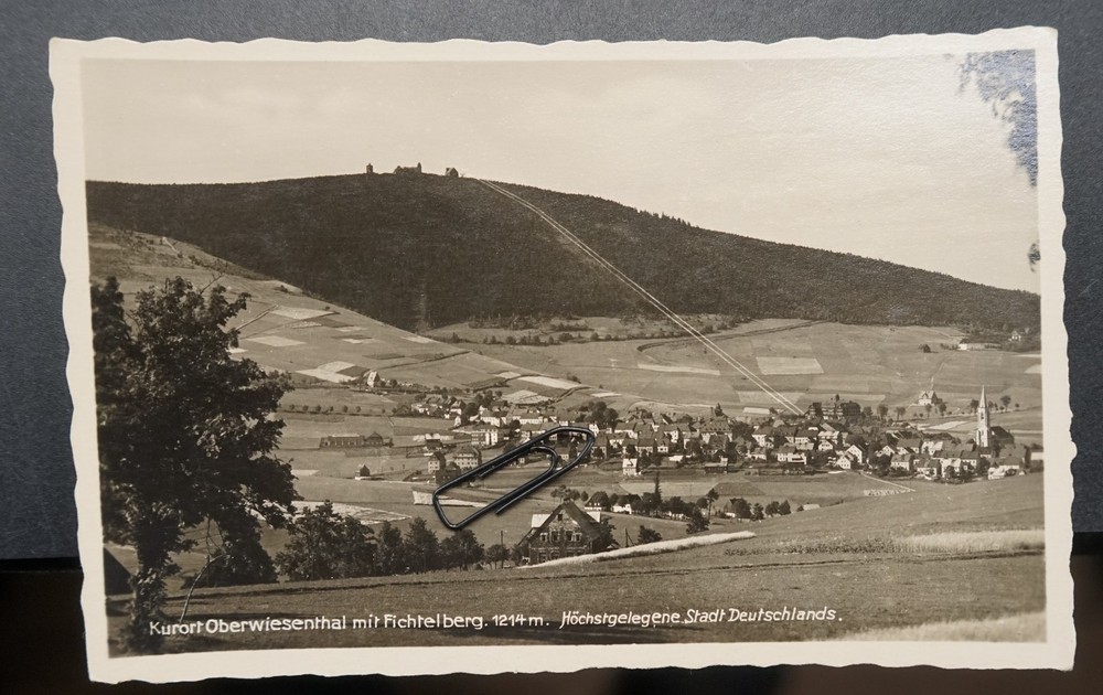 Photo postcard view GDR Oberwiesenthal Fichtelberg Erzgebirge church house