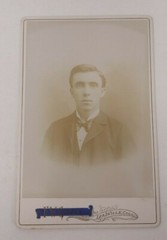 Antique Cabinet Card Photograph- Nicely dressed man in a suit taking a headshot