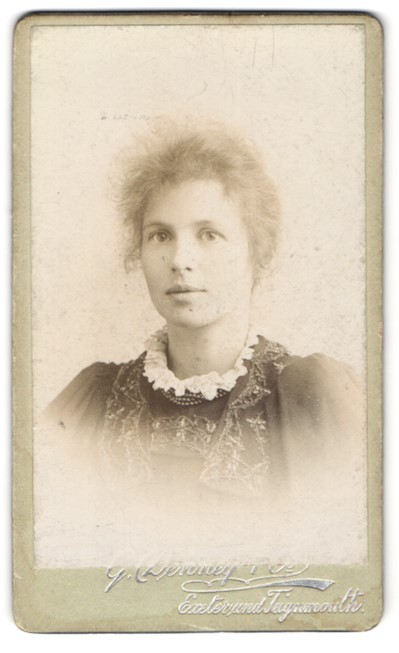 Photograph Denney & Co., Exeter, breast portrait of a woman with hair pinned up