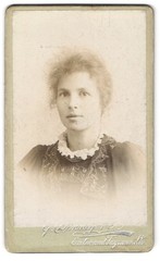 Photograph Denney & Co., Exeter, breast portrait of a woman with hair pinned up