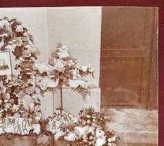 Antique Photograph Depicting a Woman’s Memorial with a Floral Arrangement