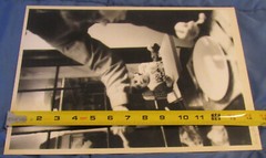 1977 Sandy Underwood photograph; child eating in high chair, 10″ x 14″