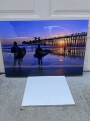 Oceanside pier sunset with surfers