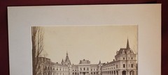Vintage Black and White Photograph of a Large Building with a Courtyard