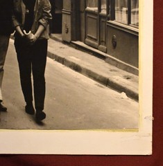 J.W. Howlett Black + White Photograph Focusing on a Man + Woman in an Urban Area