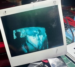 Picture Polaroid of distorted Blue TV like from a Horror Movie 1980