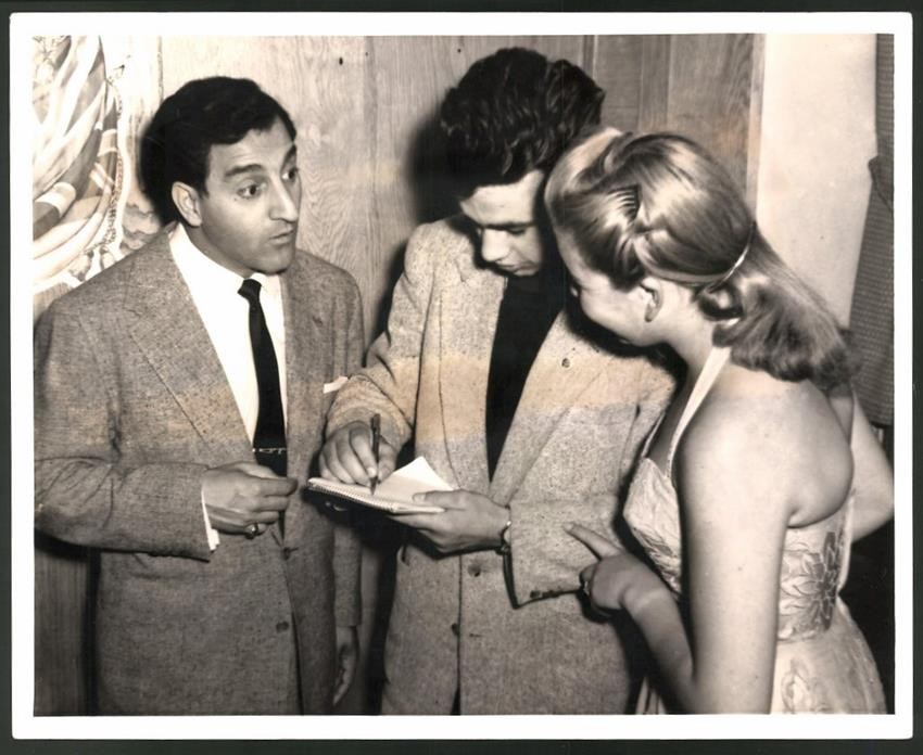 Photography Night Club Entertainer Danny Thomas gives autograph to Yvonne Stein,