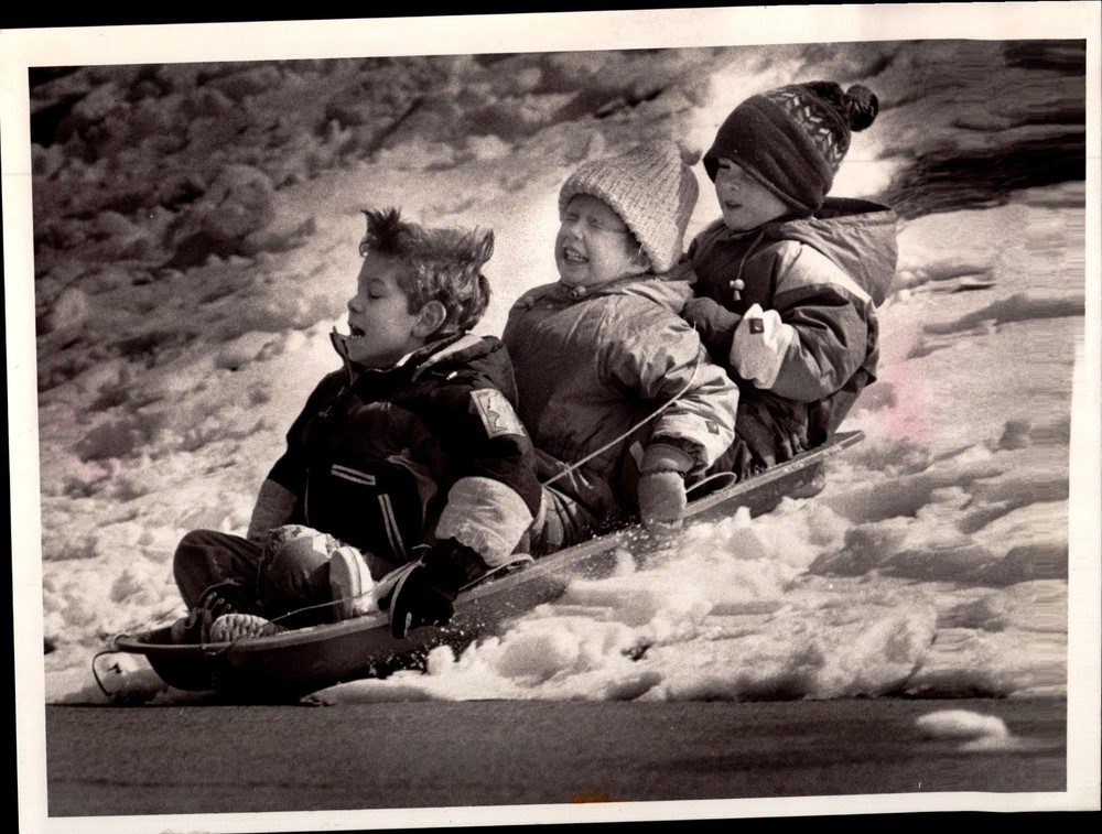 Vintage Press Photograph Children Sledding in Snow Winter Fun Adventure 1960s