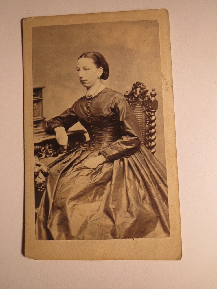 Uster 1866 Josephine von Grebel? as a sitting woman in crinoline – backdrop / CDV