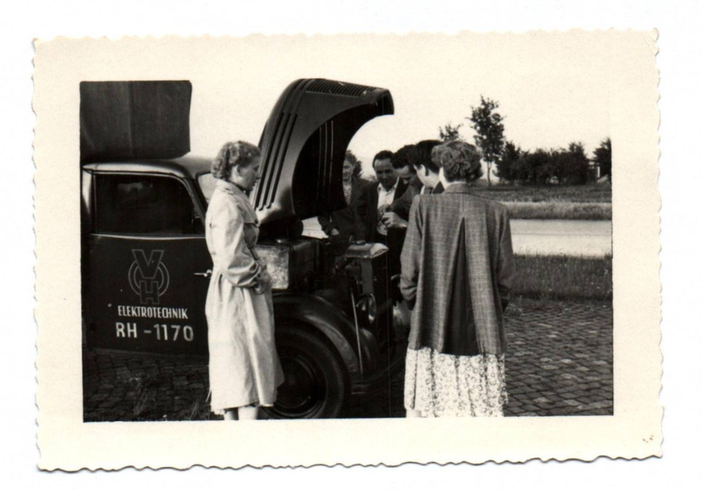 Photo Old Woman on Vintage Electrical Engineering RH – 1170 Vehicle